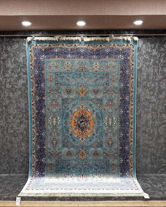 Decorative rug with intricate patterns displayed in a showroom setting.
